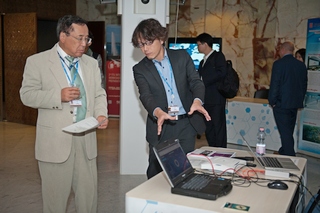 Mr Takeshi Kanazawa(right) from Panasonic demonstrates the cellular-based disaster recovery mobile network system